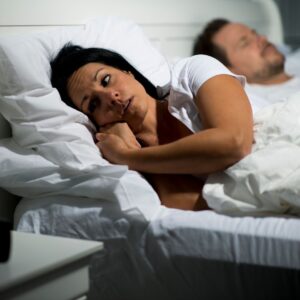 img of someone awake in bed